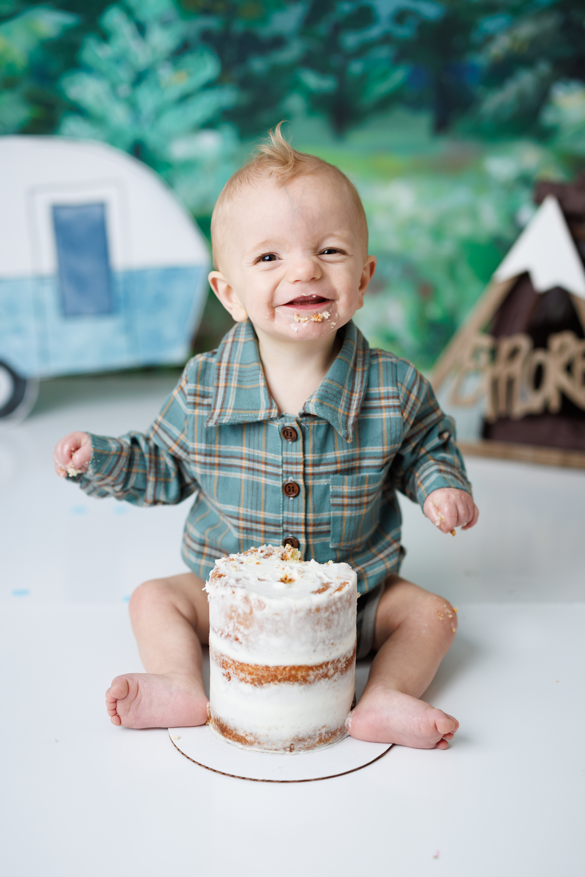 boy smiling cake smash camping